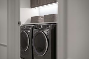A matching washer and dryer pair in a home laundry room